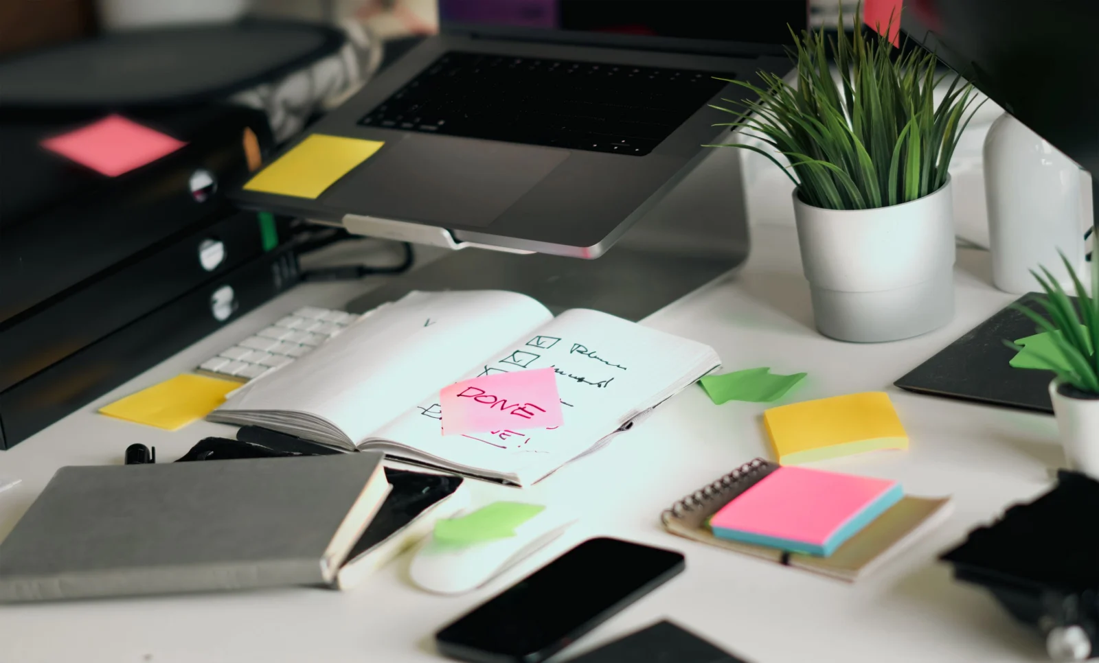 Laptop and checklist for planning small business automation